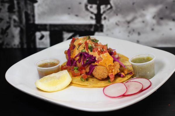 Fish Taco!
 
 
 Fried cod, cabbage, pico de gallo, cabbage, and chipotle crema