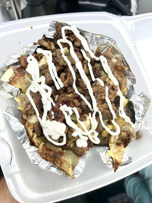 Papa asada with bistec, cheese, and sour cream.