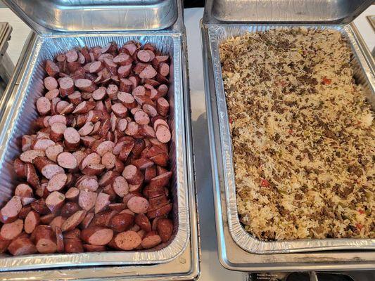 Beef sausage on the left, homemade cajun rice dressing on the right