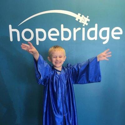 A kiddo graduating from Hopebridge.