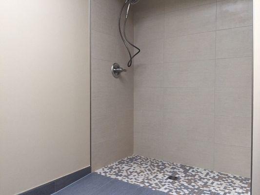 Handicap accessible bathroom complete with this curb-less roll-in shower.