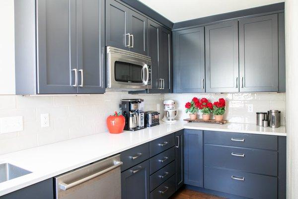 Dark blue cabinets in the butler's pantry