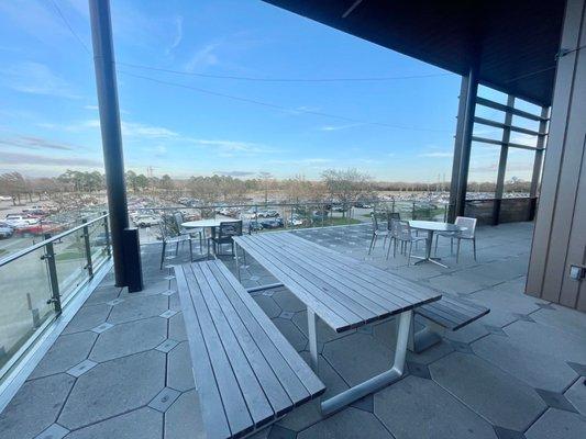 Outdoor patio with tables to hang out / study at