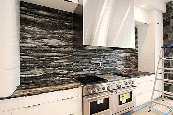 Contemporary Kitchen with black and white granite slab tops and backsplash and white high gloss cabinets