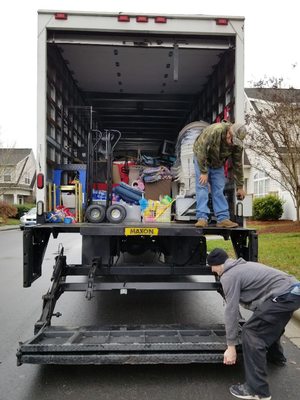 The guys getting ready to head to new location to unload