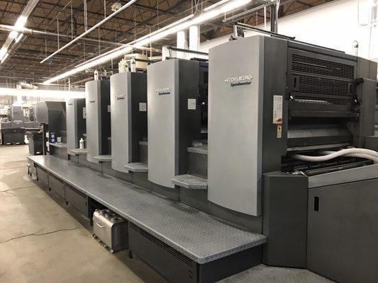 This Heidelberg is capable of printing both sides of the paper - just one of the many tools at our shop.