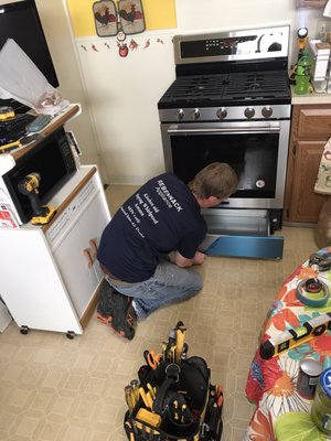 9/7/17 Rebennack's installer David placing our new range into place after installing the hood.