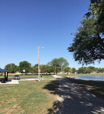 The gravel walking path circles the lake.