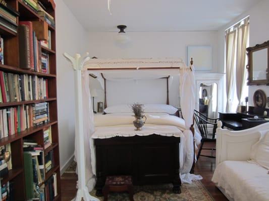 The Library Room has a queen canopy bed, a single bed and attached en suite bath.