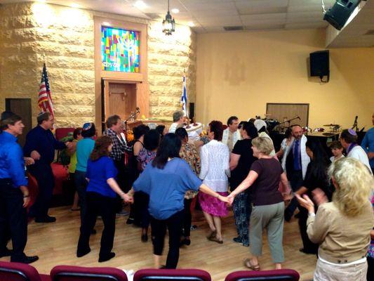 Dancing with the Torah on Simchat Torah holiday