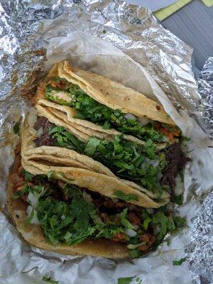 Tacos, top to bottom - pollo, barbacoa, al pastor