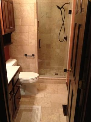 Complete bathroom remodel. Customer says, " The only problem now is I find myself staying in the shower longer."