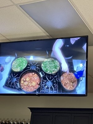 It's great how they have big monitors so you can see what the instructor is doing while you're working on the same dish at your station.