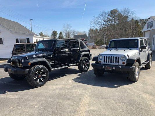 Tasteful upgrades on black Wrangler against stock Wrangler in white.