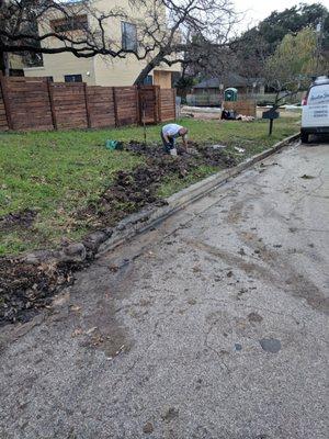 plumber fixing our water main after Splash drove a massive trailer through our yard, causing extensive damage