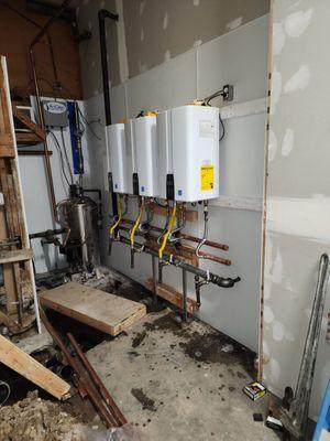 Installing commercial water heater for laundromat