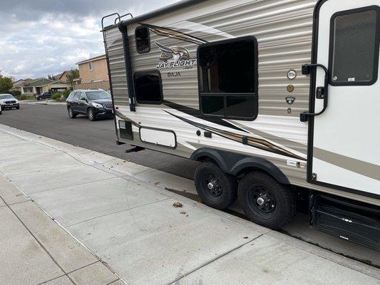 Would the HOA rather have our trailer hanging out a foot in the street on a very busy road???