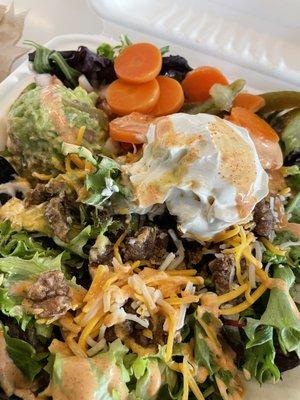 Carne asada salad - sour cream and guac cost extra but less than what Chipotle charges!