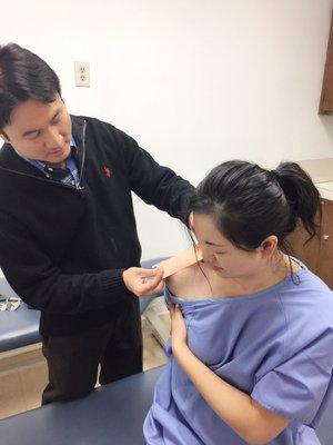 Dr.Wang applying the tape in my shoulder so I can achieve better movement from my shoulder:)