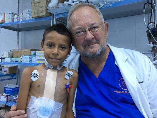 Dr William Novick with a patient in Iraq