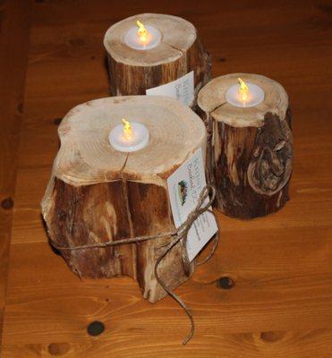 Rustic cedar log candles from logs harvested in northern Michigan, USA.