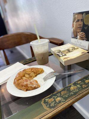 A warm apple danish and a cold brew with cold foam here.