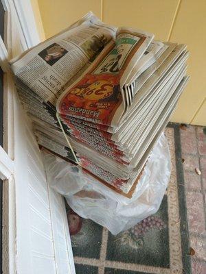 Random pile of approximately 100-150 copies of 3/6/19 paper left stacked on my porch overnight.