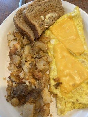 Dried out cheese omelette and tasteless hash browns.