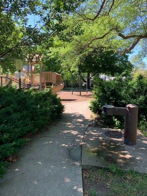 Walkway to playground and water fountain.