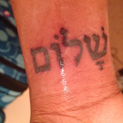 My first tattoo which is Peace in Hebrew I love it, it was a bit painful but I guess it's because of the area it also was 60$