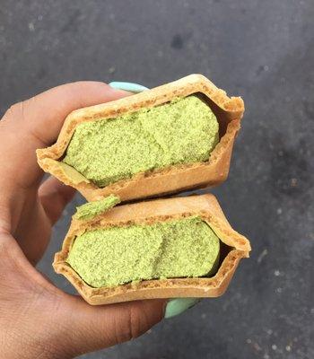 The Matcha Ice Cream inside the waffle cone with chocolate