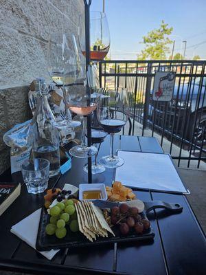 The July wine flight and the cheese and fruit board