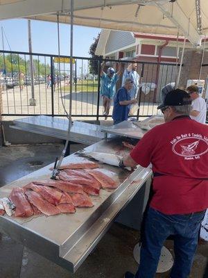 Captain Ken making quick work of a day's haul.