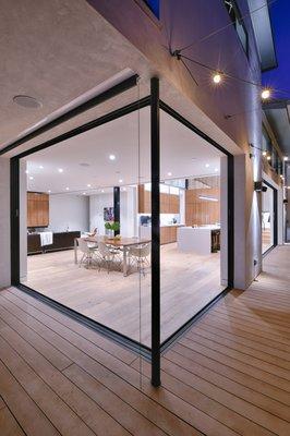 Seamless indoor/outdoor transition with pocket doors that recess into walls