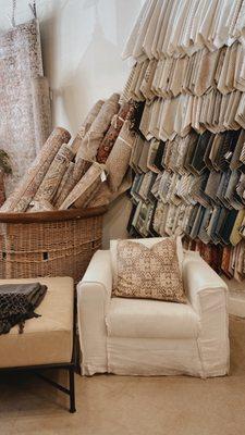 Fabric texture wall and rolled rugs