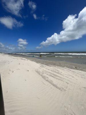 You can see how the sand is wind blown here. Water doesn't drop until after that far wave