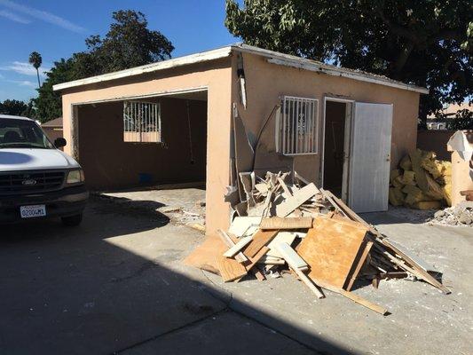 Garage and all trash neatly stacked in certain areas. Do you see additional trash lying anywhere? NO!