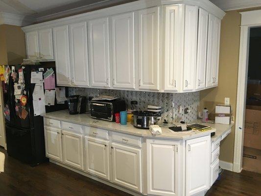 After - Cabinets professionally refinished.