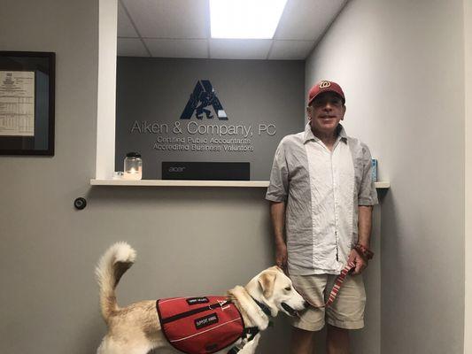 John S Leonard, CPA with client Tony Lacaria and service dog Alex