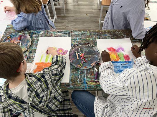 Spring Break campers learning to work with oil pastels!