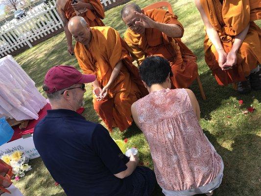 Water is central to the celebration - Bless the monks and be blessed in return!