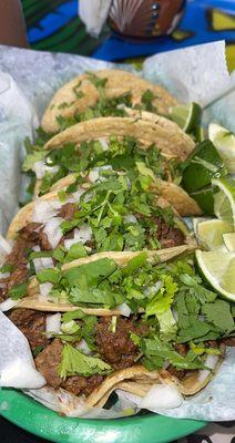 Two steak tacos with three chicken tacos