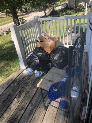 Example of the trash on the front porch of 815 S. 14th. Not my side of the porch.