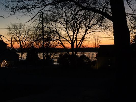 Beautiful sunset over the lake in late December. It's just starting to freeze. Soon there will be ice fishing & man caves