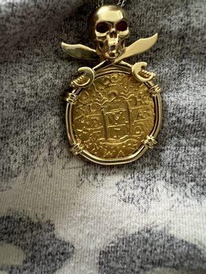 1715 Fleet shipwrecked 2 escudos aka doubloon - Lima dated 1710 mounted on 18k skull sword with ruby eyes.