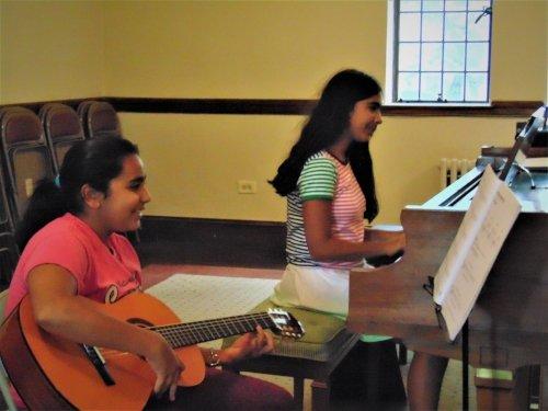 Two sisters making music together in one of our performance salons.