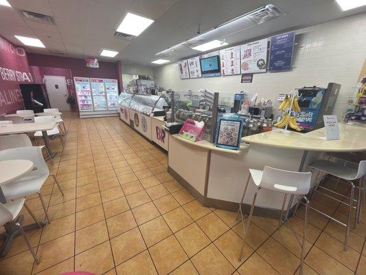 Most of the interior - cake freezers in back, dining to the left, service to the right