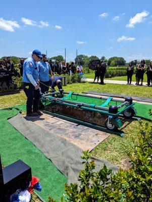 Dignity Memorial employees performing burial.