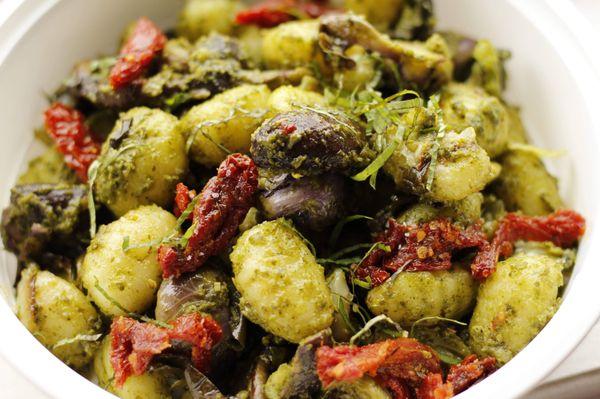 Pesto gnocchi w/ sun-dried tomatoes, crimini mushrooms & fresh basil.