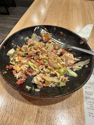 Half eaten burrito salad bowl